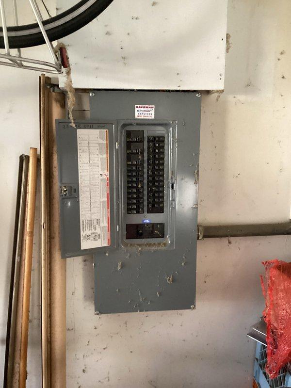 Conducted comprehensive evaluation of existing HVAC system for furnace and air conditioning replacement estimate at residential property with main floor furnace installation. Assessed electrical panel capacity and circuit availability to ensure adequate power supply for new equipment installation, documenting existing 200-amp service panel with dual columns of circuit breakers and verifying compatibility with proposed high-efficiency heating and cooling system requirements. Photographed electrical infrastructure including main breaker panel, circuit directory, and existing electrical service setup to determine any necessary electrical upgrades or modifications required for new HVAC equipment installation.