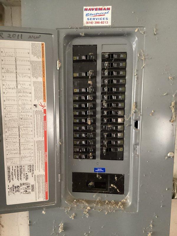 Conducted comprehensive evaluation of existing HVAC system for furnace and air conditioning replacement estimate at residential property with main floor furnace installation. Assessed electrical panel capacity and circuit availability to ensure adequate power supply for new equipment installation, documenting existing 200-amp service panel with dual columns of circuit breakers and verifying compatibility with proposed high-efficiency heating and cooling system requirements. Photographed electrical infrastructure including main breaker panel, circuit directory, and existing electrical service setup to determine any necessary electrical upgrades or modifications required for new HVAC equipment installation.