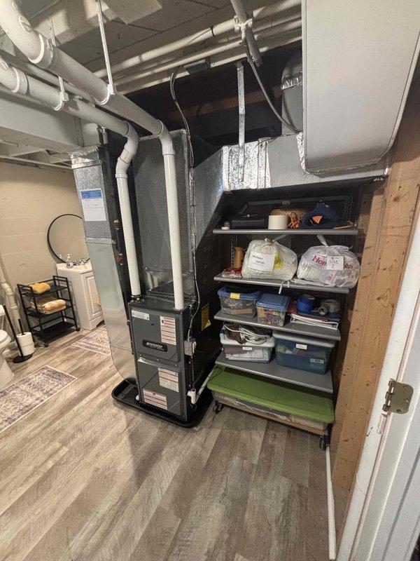 Completed full furnace replacement in basement utility area. Installed new vertical black furnace unit with proper PVC venting system, connected metallic supply and return ductwork with insulated wrapping, and ensured all manufacturer specifications were met. System tested and verified operational, with all connections secured and installation meeting code requirements.