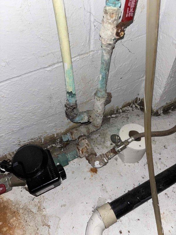 Completed gas line replacement project at residential property. Removed and replaced deteriorated gas piping system that exhibited severe corrosion, rust buildup, and mineral deposits throughout the existing infrastructure. Excavated exterior trench adjacent to foundation wall to access underground gas line routing. Installed new gas-rated piping from exterior meter connection point through foundation penetration to interior distribution manifold. Secured all new piping to foundation wall with proper strapping and support brackets per code requirements. Pressure tested completed gas line system to verify integrity of all connections and fittings. Backfilled exterior excavation and restored work area to original grade.