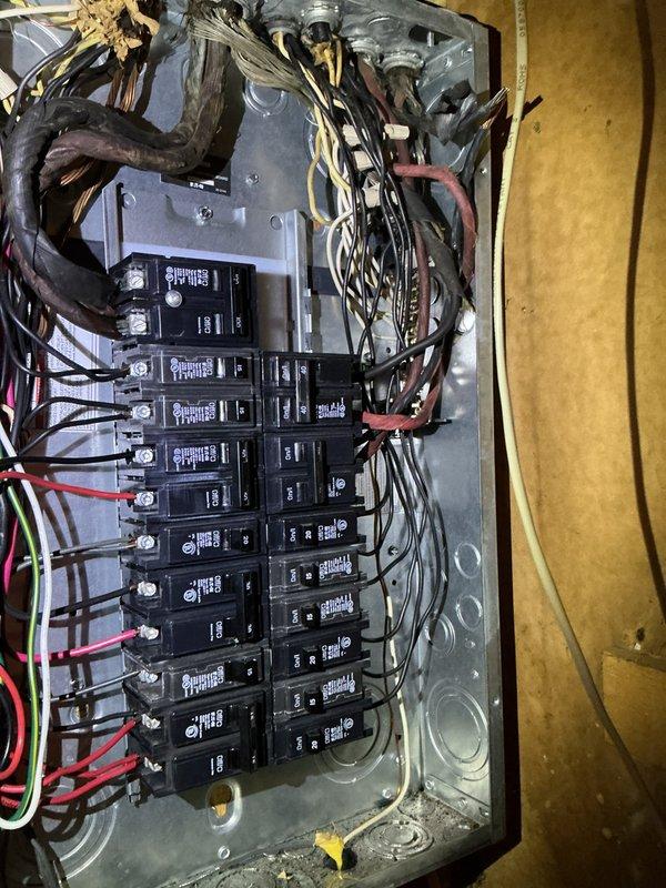 Conducted electrical estimate for bathroom exhaust fan installation to address improperly vented bathroom opening that currently leads directly into insulation cavity. Assessed existing electrical panel capacity and evaluated exterior wall penetration requirements for proper ductwork termination through brick exterior with appropriate weatherproofing and damper installation.