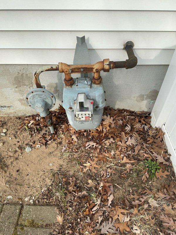 Conducted on-site evaluation for standby generator installation. Assessed existing electrical panel location and capacity, documented current service entrance configuration, and evaluated gas meter placement and condition for generator fuel supply connection. Photographed electrical infrastructure and gas utility equipment to support equipment sizing and installation planning.