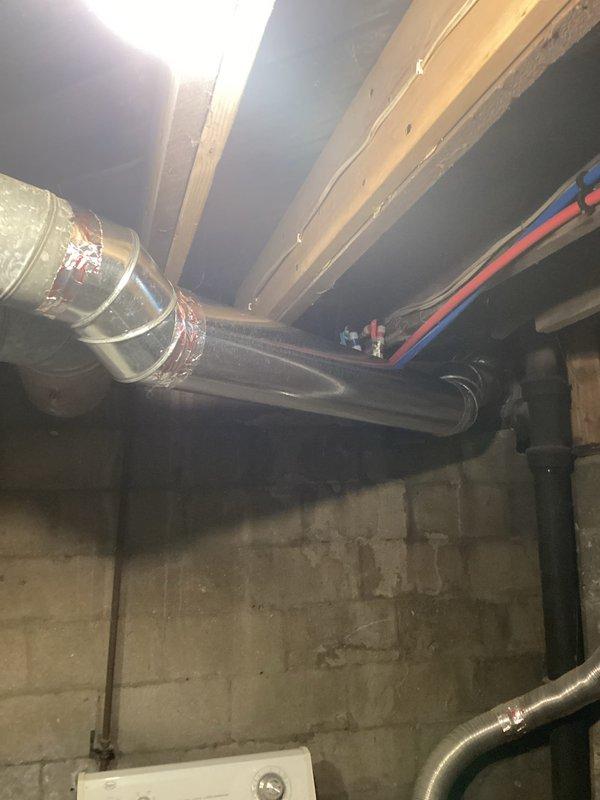 Replaced 10 feet of damaged 7-inch flexible ductwork in basement utility area. New duct installed with proper connections and secured to existing HVAC system, restoring airflow efficiency. Work completed with minimal disruption to surrounding plumbing and mechanical systems.