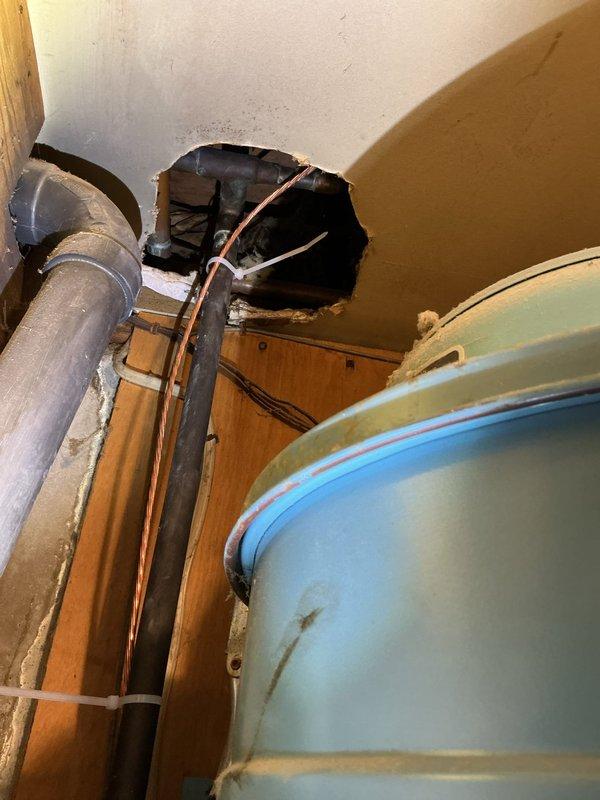 Responded to service call for non-functional exterior faucet with missing handle. Upon arrival, located galvanized steel spigot protruding from stone foundation at ground level, surrounded by accumulated leaf debris. Assessed exterior hose bib assembly and determined handle mechanism was absent, preventing water control. Accessed interior plumbing connections through basement utility area to verify supply line integrity and shut-off valve functionality. Replaced defective exterior faucet assembly with frost-proof sillcock, ensuring proper installation through foundation wall and secure mounting to prevent future damage. Tested water flow and verified complete shut-off capability of new handle assembly.