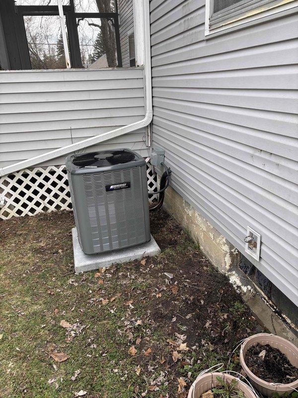Completed full HVAC system replacement including installation of new air handler unit in mechanical room and outdoor condensing unit. Air handler was positioned on protective mat with proper PVC condensate drainage lines routed to floor drain, and new outdoor condenser was mounted on concrete pad against exterior wall with electrical conduit properly secured to building. All refrigerant lines were connected, system was pressurized and leak tested, electrical connections were verified, and unit was successfully started up and tested for proper operation across all heating and cooling modes.