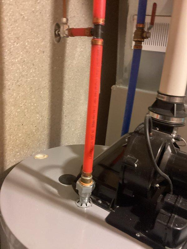 Provided estimate for water heater replacement on existing A.O. Smith ProLine XE unit located in basement utility area. Documented current installation including circulation pump assembly, PEX piping configuration with red and blue supply lines, brass valve connections, and copper fittings for customer review and approval.