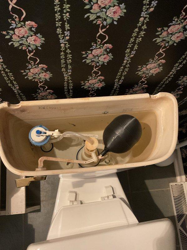 Responded to early availability request for toilet and drain issues. Inspected toilet tank and found failed flapper assembly with broken flush lever arm preventing proper seal and causing continuous running. Replaced flapper mechanism and flush lever components, tested flush operation to confirm proper sealing and water shutoff. Addressed slow-draining bathroom sink by clearing debris from pop-up assembly and P-trap. Verified proper drainage flow on both fixtures before completion.