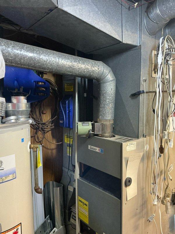 Completed in-home estimate for replacement of 45-year-old furnace and air conditioning system. Assessed existing HVAC equipment in basement mechanical room, documented current installations including furnace with humidifier attachment and associated ductwork configuration, and discussed available upgrade options including current promotional offerings with customer.