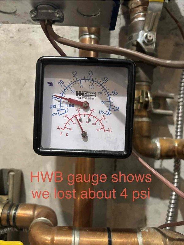 Returned to site to recheck previously completed boiler repairs and monitor system performance. Upon inspection, confirmed the in-floor heating zone pressure has remained stable with no pressure loss detected. However, identified approximately 4 PSI pressure drop on the hot water boiler system since last service visit. Documented current pressure and temperature readings on both heating zones using installed pressure gauges. Photographed gauge readings for service records showing in-floor system holding steady while main boiler system experiencing minor pressure loss. System remains operational with continued monitoring recommended.