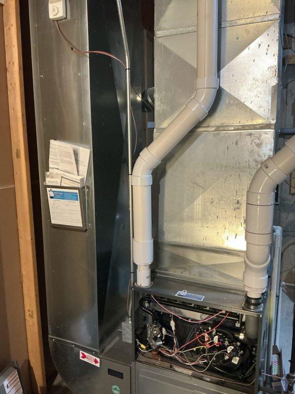 Completed annual heating maintenance on EnergiAir furnace (2018 model) and Honeywell drum-style humidifier system. Performed comprehensive tune-up including inspection of heat exchanger, burner assembly, ignition components, and blower motor operation. Verified proper venting through PVC exhaust system, checked all electrical connections and control board functionality, and tested safety switches. Inspected humidifier operation, water supply lines, and drum assembly for proper seasonal performance. All systems operating within manufacturer specifications with no deficiencies noted.