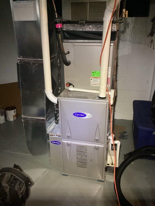 Completed annual heating maintenance on 8-year-old Carrier furnace system. Performed comprehensive tune-up including inspection of heat exchanger, burner assembly, and ignition components. Verified proper operation of blower motor and checked all electrical connections. Cleaned flame sensor and tested safety controls for proper function. Inspected and cleaned burners, confirmed gas pressure within manufacturer specifications. Checked flue system for proper venting and tested for carbon monoxide. Replaced furnace filter and verified proper airflow throughout system. Tested thermostat operation and system cycling. Inspected condensate drain line for blockages and confirmed proper drainage. All components found to be operating within normal parameters. System tested under full heating load with satisfactory performance. Unit left in proper working condition and ready for heating season.