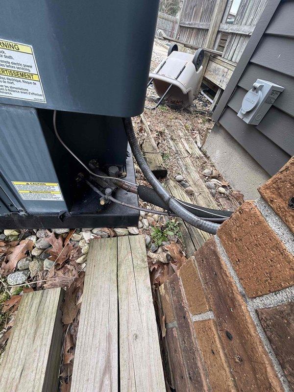 # AC Unit Relocation for Pool Installation

Relocated outdoor air conditioning condenser unit to accommodate backyard pool construction. Disconnected refrigerant lines, electrical connections, and safely moved equipment to new position on gravel pad adjacent to building exterior. Repositioned unit to maintain proper clearances from structure and ensure adequate airflow around condenser. Reconnected all electrical supply lines and refrigerant piping, verified secure mounting, and confirmed equipment placement allows access for future service needs while clearing space for pool installation area.