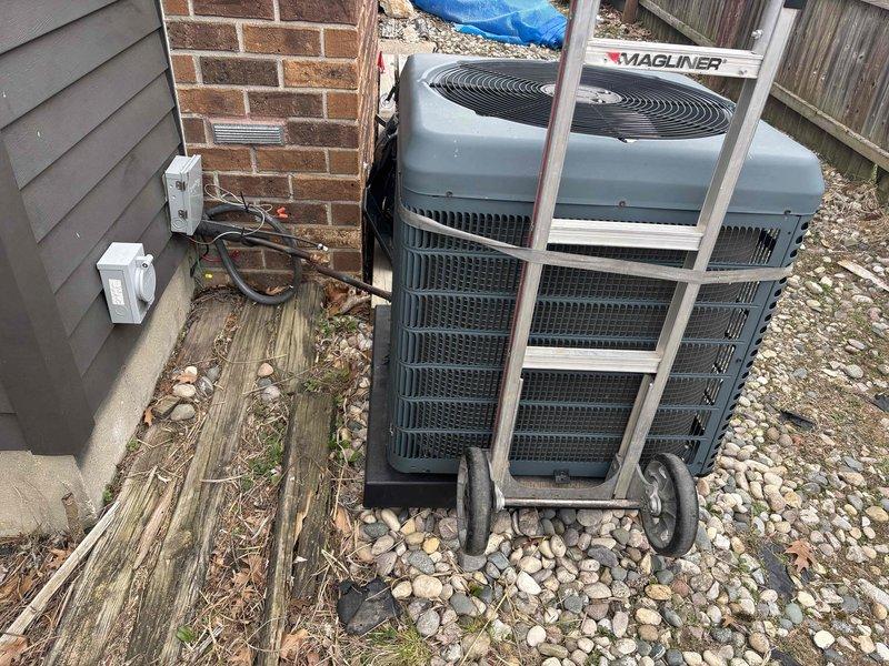 # AC Unit Relocation for Pool Installation

Relocated outdoor air conditioning condenser unit to accommodate backyard pool construction. Disconnected refrigerant lines, electrical connections, and safely moved equipment to new position on gravel pad adjacent to building exterior. Repositioned unit to maintain proper clearances from structure and ensure adequate airflow around condenser. Reconnected all electrical supply lines and refrigerant piping, verified secure mounting, and confirmed equipment placement allows access for future service needs while clearing space for pool installation area.