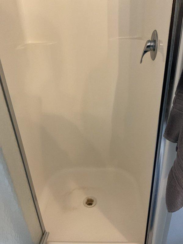 Responded to recurring drainage issue in bathroom where water backs up every couple of months. Performed cable snaking of drain line servicing shower and vanity sink to clear blockage and restore proper drainage flow. Verified both fixtures draining properly upon completion.