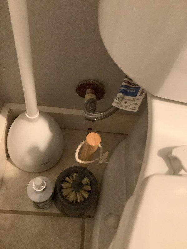 Arrived on-site to provide toilet replacement quote as requested. Performed thorough inspection of existing standard white porcelain toilet in half bathroom. Assessed current installation including floor mounting, water supply connection with braided metal supply line, and flush mechanism components. Documented existing conditions with photographs showing toilet positioning, surrounding space constraints, flooring condition, and internal tank components including flush valve assembly and fill valve. Examined access panel for plumbing accessibility. Reviewed bathroom layout to determine replacement requirements and potential installation considerations. Trip charge waived per management authorization. Provided detailed replacement quote to customer for review and decision.