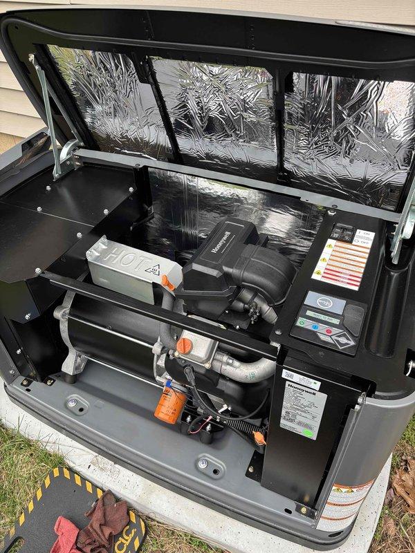 Completed routine preventive maintenance on 20-year-old residential Generac generator. Performed comprehensive system inspection including visual examination of all major components, electrical connections, and mechanical assemblies. Replaced engine oil filter with OEM Generac filter and replenished engine oil to proper level in reservoir. Inspected coolant system, refrigerant lines, and all hose connections for signs of wear or leakage—all found secure and in satisfactory condition. Verified integrity of electrical components, control panel labels, and safety warning indicators. Examined compressor assembly, accumulator, and associated copper refrigerant lines for proper installation and condition. Confirmed all mounting hardware, brackets, and clamps properly secured. Unit access panel insulation intact with no damage noted. System showing normal wear consistent with age but operating within acceptable parameters with no immediate performance concerns identified. Generator ready for 