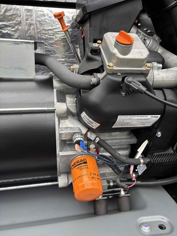 Completed routine preventive maintenance on 20-year-old residential Generac generator. Performed comprehensive system inspection including visual examination of all major components, electrical connections, and mechanical assemblies. Replaced engine oil filter with OEM Generac filter and replenished engine oil to proper level in reservoir. Inspected coolant system, refrigerant lines, and all hose connections for signs of wear or leakage—all found secure and in satisfactory condition. Verified integrity of electrical components, control panel labels, and safety warning indicators. Examined compressor assembly, accumulator, and associated copper refrigerant lines for proper installation and condition. Confirmed all mounting hardware, brackets, and clamps properly secured. Unit access panel insulation intact with no damage noted. System showing normal wear consistent with age but operating within acceptable parameters with no immediate performance concerns identified. Generator ready for 