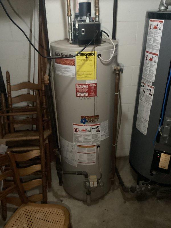 Responded to service call for A.O. Smith water heater experiencing intermittent circulating pump cycling and complete loss of hot water accompanied by unusual noises. Upon inspection, diagnosed malfunctioning recirculation pump assembly mounted at top of unit causing system failure. Evaluated electrical connections, plumbing configuration, and overall water heater operation. Documented equipment condition and mechanical systems for further assessment and repair recommendations.