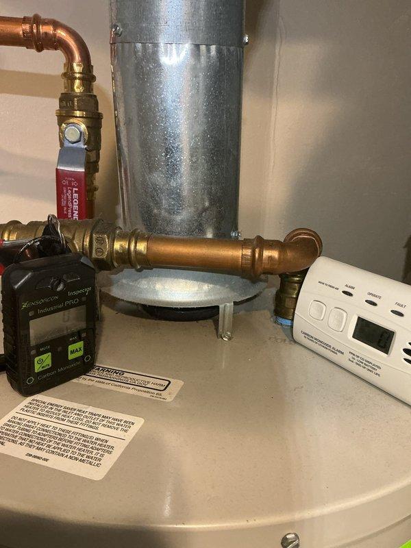 Responded to complaint of excessively high water temperatures (290°F) at shower fixtures on 3-year-old Bradford White water heater. Inspected digital control unit settings, tested temperature output at fixtures, and examined mixing valve configuration. Verified proper installation of pressure relief valve and copper piping connections. Adjusted temperature settings on control unit and confirmed proper operation of tempering valve to prevent scalding conditions. Educated occupant on safe temperature parameters and proper system operation.