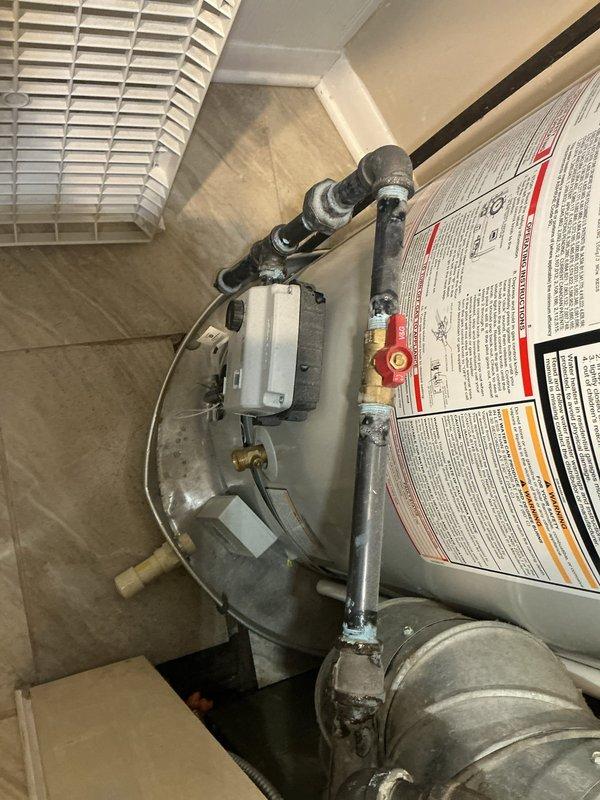 Responded to complaint of excessively high water temperatures (290°F) at shower fixtures on 3-year-old Bradford White water heater. Inspected digital control unit settings, tested temperature output at fixtures, and examined mixing valve configuration. Verified proper installation of pressure relief valve and copper piping connections. Adjusted temperature settings on control unit and confirmed proper operation of tempering valve to prevent scalding conditions. Educated occupant on safe temperature parameters and proper system operation.