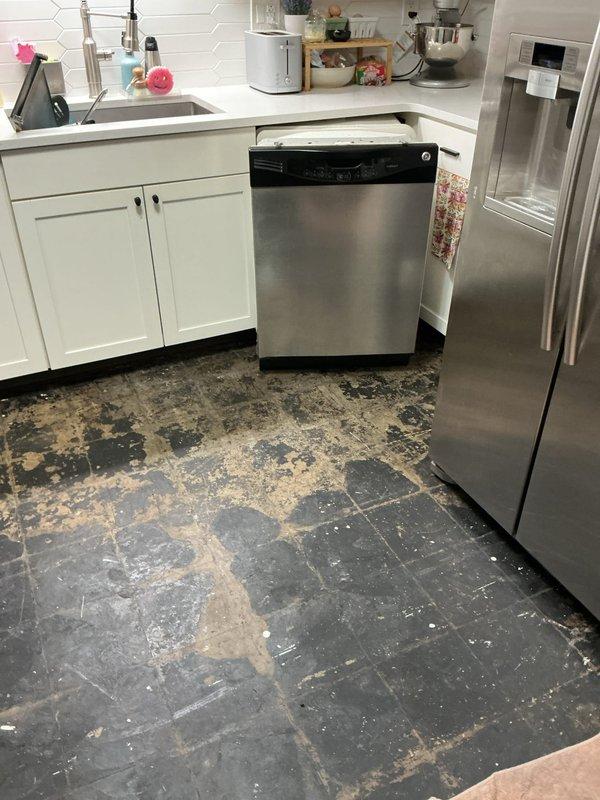 Responded to emergency plumbing leak that caused extensive water damage to kitchen flooring. Upon arrival, identified and repaired the source of the leak, then documented the resulting damage to the slate tile flooring, which showed significant deterioration with multiple tiles missing, exposed subflooring, and widespread surface wear throughout the kitchen area. The water intrusion had compromised both the tile adhesive and flooring material, requiring comprehensive photographic documentation for insurance purposes and future restoration work.