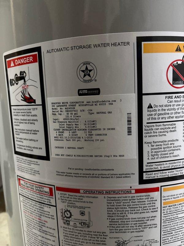 Completed installation of a 40-gallon automatic storage water heater rated at 41,000 BTU/H natural gas input. Installed new unit with proper venting system utilizing stainless steel exhaust ductwork with flexible coupling connections routed through ceiling joists. Connected copper supply and distribution lines to existing plumbing infrastructure. Verified all gas pressure specifications, safety controls, and clearance requirements per manufacturer guidelines. Ensured proper labeling and safety warnings visible on unit exterior, including temperature and scalding hazard notifications. Tested pilot ignition system and burner operation to confirm functionality. All work completed within one-hour service window with system fully operational upon departure.