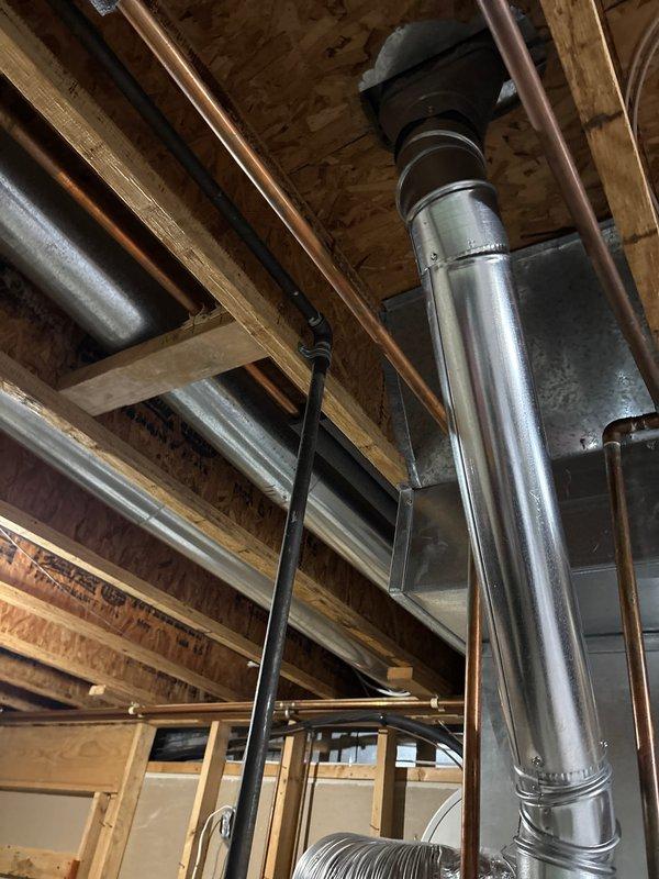 Completed installation of a 40-gallon automatic storage water heater rated at 41,000 BTU/H natural gas input. Installed new unit with proper venting system utilizing stainless steel exhaust ductwork with flexible coupling connections routed through ceiling joists. Connected copper supply and distribution lines to existing plumbing infrastructure. Verified all gas pressure specifications, safety controls, and clearance requirements per manufacturer guidelines. Ensured proper labeling and safety warnings visible on unit exterior, including temperature and scalding hazard notifications. Tested pilot ignition system and burner operation to confirm functionality. All work completed within one-hour service window with system fully operational upon departure.
