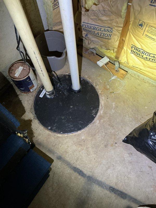 Responded to service call for non-functioning sump pump system with suspected float switch malfunction. Upon arrival, inspected sump pump pit and components in basement utility area. Evaluated float mechanism operation and tested pump functionality. Documented existing conditions of sump pump installation, including PVC discharge piping configuration and pit cover assembly for service records.