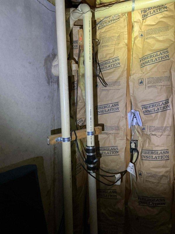 Responded to service call for non-functioning sump pump system with suspected float switch malfunction. Upon arrival, inspected sump pump pit and components in basement utility area. Evaluated float mechanism operation and tested pump functionality. Documented existing conditions of sump pump installation, including PVC discharge piping configuration and pit cover assembly for service records.