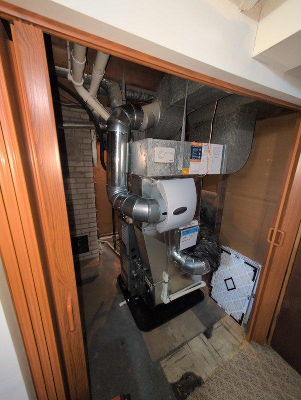 Completed full furnace replacement in confined basement mechanical room. Installed new furnace unit with corresponding ductwork connections, including flexible metallic ductwork with proper insulation wrapping. Connected all necessary PVC condensate drainage lines, verified proper placement of drain pan beneath equipment, and ensured all supply and return air duct transitions were properly sealed. System tested and operational upon completion.