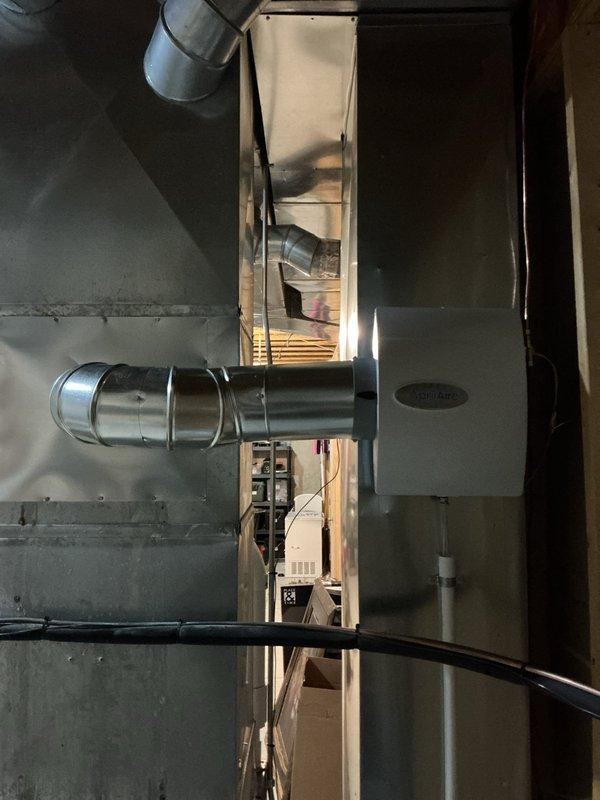 Completed installation of manual humidifier unit on residential HVAC system. Installed humidifier assembly with appropriate ductwork connections and water supply line routed through attic space to air handler. System tested and verified operational upon completion.