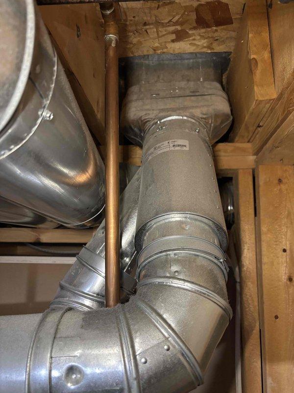Responded to odor complaint regarding plastic smell coming from furnace. Upon arrival, system was off per homeowner request. Conducted thorough inspection of HVAC system and ductwork to identify source of odor. Examined furnace components, filter housing, and accessible ductwork in unfinished space. Documented equipment conditions with photos including water heater specifications and overhead ductwork configuration. No active odor detected at time of inspection with system powered down.