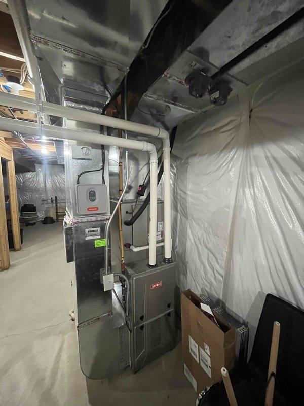 Responded to no-charge service call to retrieve temperature probe from residential basement mechanical room. Upon arrival, accessed basement HVAC area containing Bryant furnace with associated ductwork and plumbing systems. Located and collected temperature probe as requested. Documented existing equipment configuration with photos showing furnace installation, PVC venting, supply/return ductwork with foil-faced insulation, and general mechanical room layout. No repairs or adjustments were necessary for this pickup service.