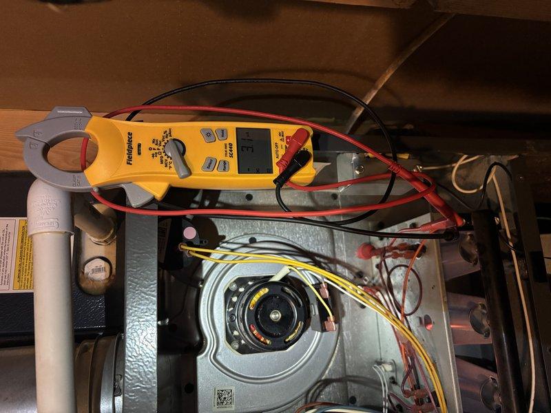 Completed annual heating maintenance on 2018 EnergiAir furnace system without humidifier, currently under warranty through June 2028. Performed comprehensive tune-up including electrical diagnostics using clamp meter to verify proper amperage draw on blower motor, inspected all wire connections and terminals for integrity, examined blower assembly and motor operation, and verified proper system function. All components found operating within normal parameters with no issues identified during inspection.