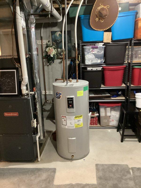 Responded to service call for 13-year-old Bradford White water heater experiencing premature hot water depletion. Unit was producing hot water but failing to maintain adequate supply duration. Upon inspection, documented existing installation and verified complaint of early cutout during hot water draw. Photographed unit specifications, labeling, plumbing connections, and control components for service records.