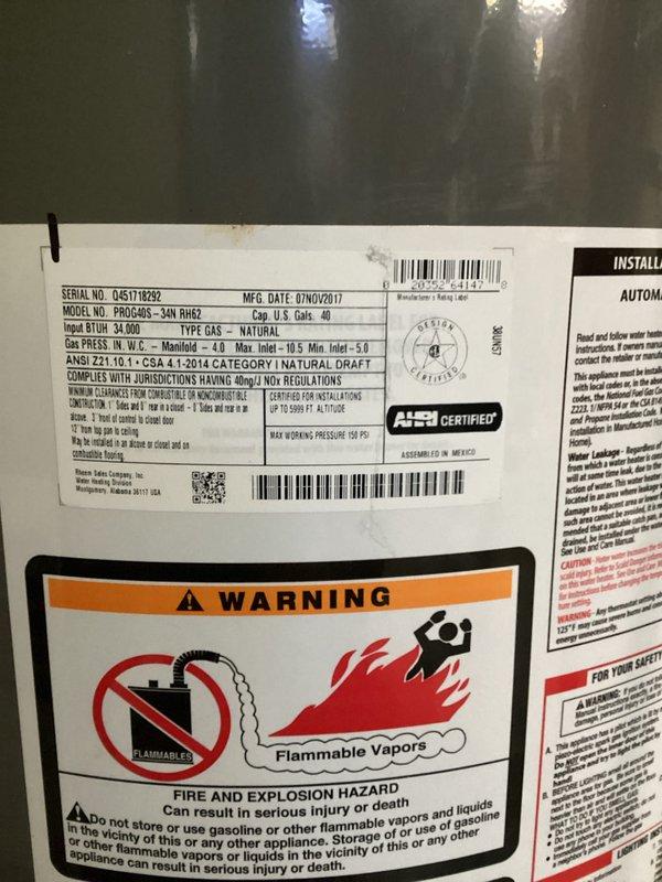 Responded to water leak concern involving 8-year-old Rheem 40-gallon natural gas water heater (Model PROH40S-3AN RH62, manufactured 07/2017) in 50-year-old home. Conducted thorough inspection of unit and surrounding area to identify source of water spreading across floor. Documented equipment condition, venting system, and installation configuration with photographs for diagnostic purposes and customer records.