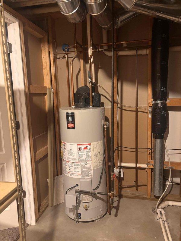 Responded to urgent carbon monoxide alarm reported by third-party inspector. Upon arrival, conducted comprehensive CO testing throughout the residence and mechanical areas. Inspected water heater installation in basement utility room, examining venting system, flue pipe connections, and combustion air supply. Found water heater exhaust venting system improperly configured with potential for CO spillage. Verified exterior PVC vent termination was incorrectly installed, creating backdraft conditions. Corrected all venting issues to manufacturer specifications, ensuring proper draft and safe exhaust discharge. Performed combustion analysis and confirmed CO levels returned to safe parameters (0 ppm) throughout living spaces. Tested all CO detectors for proper operation. Provided written documentation of corrections made and test results to homeowner as requested.