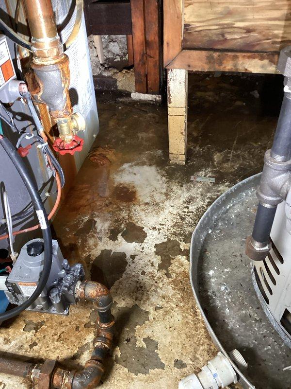 Responded to emergency service call for 4-year-old Utica WT 5-2031 boiler spraying water and failing to heat. Upon arrival, found extensive water damage on basement floor with significant moisture intrusion around boiler system and structural components. Inspected boiler unit, associated piping, valves, and mechanical connections. Identified source of water leak at brass valve assembly and compromised fittings. Examined control components, wiring, and flexible metal conduits for water damage and proper operation. Documented condition of equipment, extent of water damage to floor and surrounding area, and mechanical system configuration. Addressed immediate leak issue to prevent further water damage and restore heating functionality to the system.