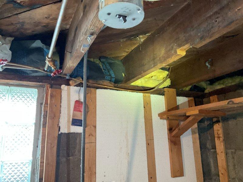 Responded to gas leak at dryer hookup location where customer had already disconnected gas supply. Upon inspection of the basement utility area, assessed the copper gas line connection and confirmed that the existing hookup required replacement due to leak at connection point. Documented the condition of the gas piping system and surrounding mechanical infrastructure with photographic evidence for service records.
