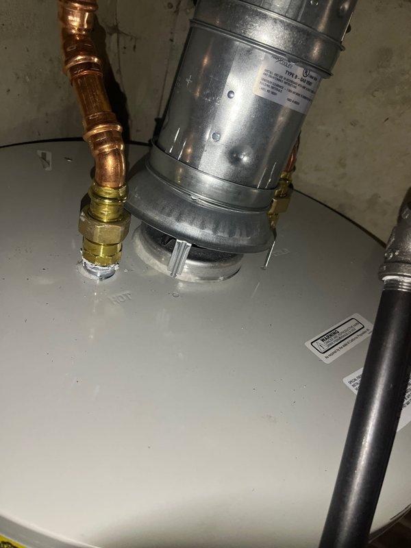 Responded to inspector correction for improperly seated Hart and Cooley B-vent joint. Corrected installation by properly seating tabs into groove and securing snap ring in place. Verified draft hood connection to water heater top for proper seating and secure fit. Documented corrected installation with photos and submitted for inspector approval.