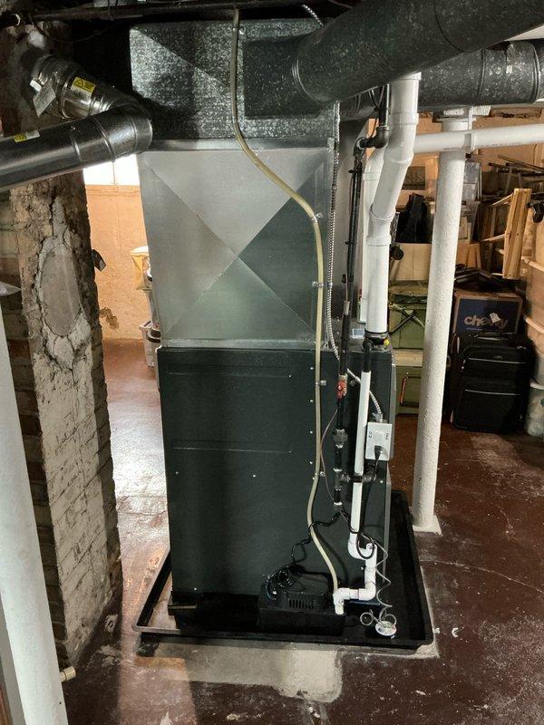 Completed comprehensive air conditioning estimate for club member at residential property. Evaluated existing HVAC system in basement mechanical room, including furnace unit with associated ductwork and PVC venting, and documented equipment specifications and installation conditions through detailed photography. Customer provided free upgrade opportunity and indicated decision timeline extending beyond early April.