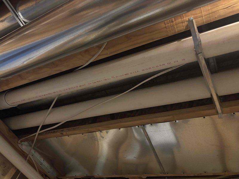 Corrected building code violations identified during mechanical inspection. Replaced non-compliant cellular core PVC vent pipe on furnace exhaust side with proper venting materials per manufacturer installation specifications and M1401.1-2015 MRC requirements. Sealed all joints in newly installed trunk line ductwork and return air drop to meet air sealing standards per M1601.4.1-2015 MRC, ensuring proper system performance and code compliance.