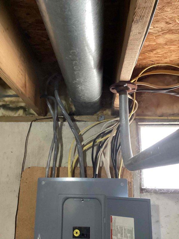 Conducted site assessment for whole-house generator installation at residential condominium property built in 1989. Evaluated existing electrical infrastructure including main service panel located in basement utility area and exterior meter bank configuration with three meters and associated disconnect boxes. Documented current electrical service capacity, panel accessibility, and potential mounting locations for automatic transfer switch. Photographed existing conditions to develop comprehensive installation proposal accounting for integration with 2017 electrical system components and required code-compliant connections for standby power system.