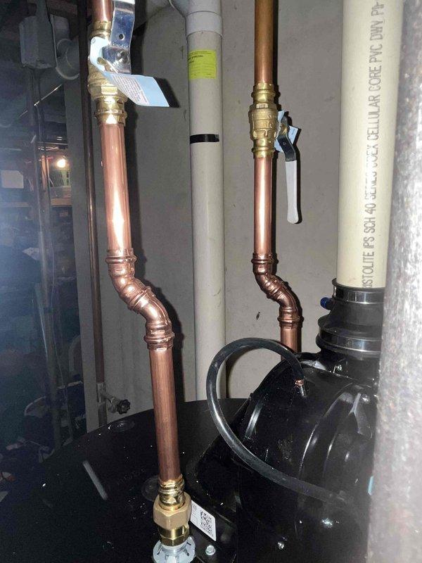 Responded to water leak on newly installed A.O. Smith tank water heater with weakened supply line and suspected gator hook leak. Replaced failed flexible stainless steel braided water supply lines with new compression-fitted hoses. Inspected copper piping connections, brass valves, and all related plumbing fixtures to ensure proper installation and eliminate additional leak sources, restoring system to full operation.