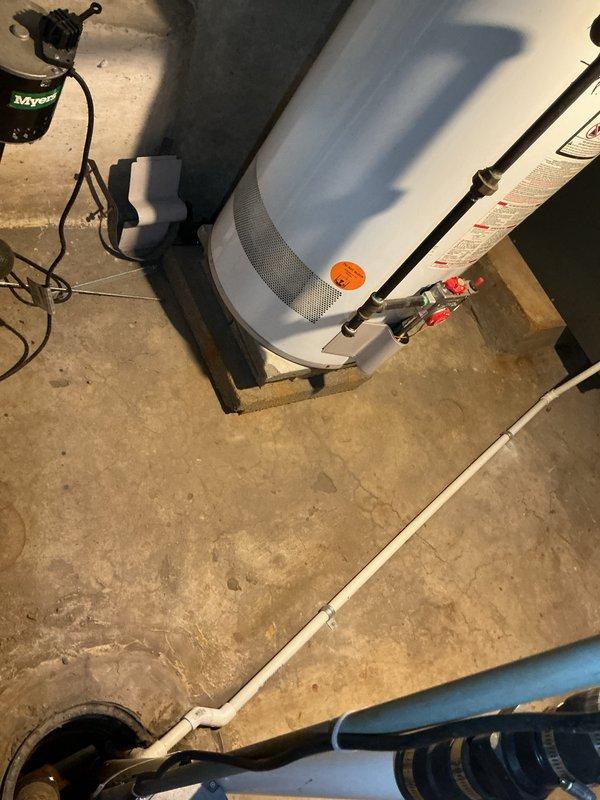 Completed comprehensive furnace super tune-up on 15-year-old Amana unit accessed through rear basement entry. Performed full system inspection, cleaned and tested all components, verified proper operation of heating system, and documented equipment condition with photos showing basement mechanical area and water heater vicinity.