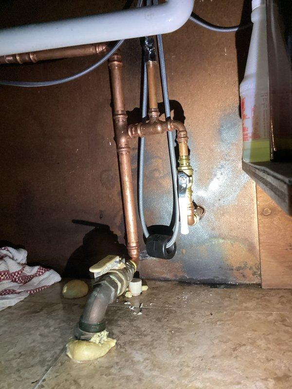 Responded to under-sink plumbing leak and performed necessary repairs. Replaced deteriorated copper pipe sections and compression fittings, installed new brass connections, and applied expanding foam insulation around pipe joints to prevent future moisture issues. All connections were tested for leaks and system restored to full functionality.
