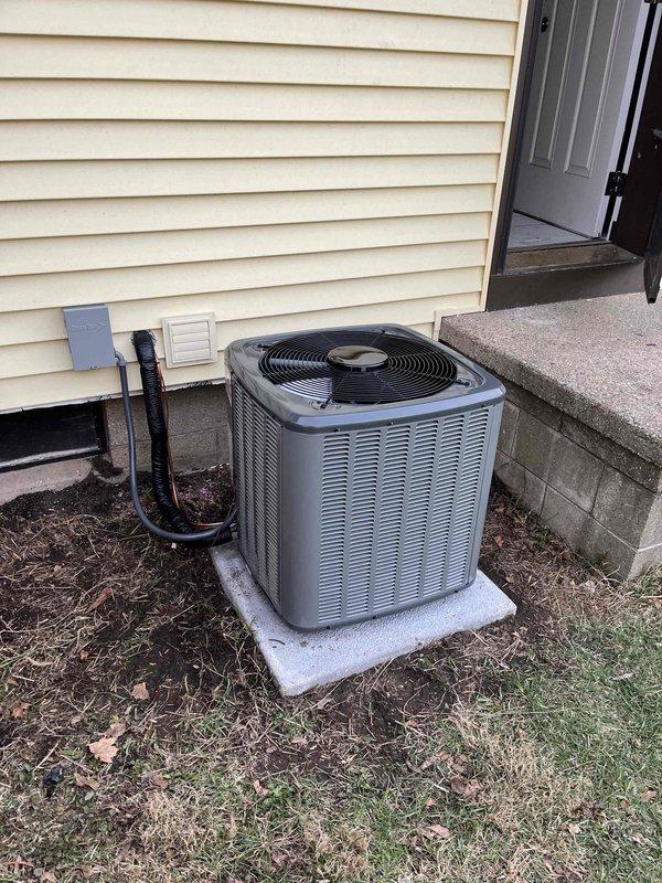 Completed full HVAC system installation including Lennox furnace and air handler in basement with associated ductwork, condensate drainage, and electrical connections. Installed outdoor condensing unit on concrete pad with refrigerant line set and electrical conduit routed through exterior wall penetration. All components properly mounted, connected, and tested for operational performance per manufacturer specifications.