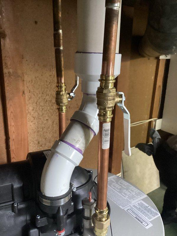 Completed installation of 40-gallon Bradford White power vent natural gas water heater. Installed new copper supply lines with brass shut-off valves, connected gas line with proper shutoff valve, and installed PVC venting system. All connections tested and verified for proper operation with no leaks detected.