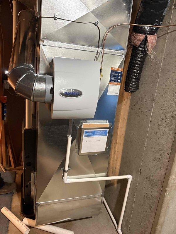 Completed full installation of new HVAC furnace system with integrated Aprilaire humidifier and Bradford White 50-gallon natural gas water heater (Model RG1PV5086N19, 40,000 BTU input). Installation included proper ductwork connection, metallic supply and return ducting, insulated flex duct routing, condensate drainage system with PVC piping, and copper water supply lines. All equipment installed to manufacturer specifications with proper clearances, gas pressure settings verified, and system tested for safe operation.