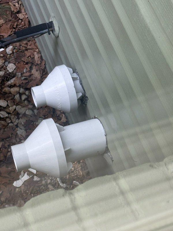 Responded to follow-up service call to address incomplete trim work from previous installation. Upon arrival, collected and removed loose PVC pipe fittings and connectors that had been left at the exterior foundation of the structure. Completed cleanup of installation debris including pipe reducers and adapters found near building perimeter and corrugated siding areas. Ensured all remaining materials were properly removed from the property to finalize the installation work.